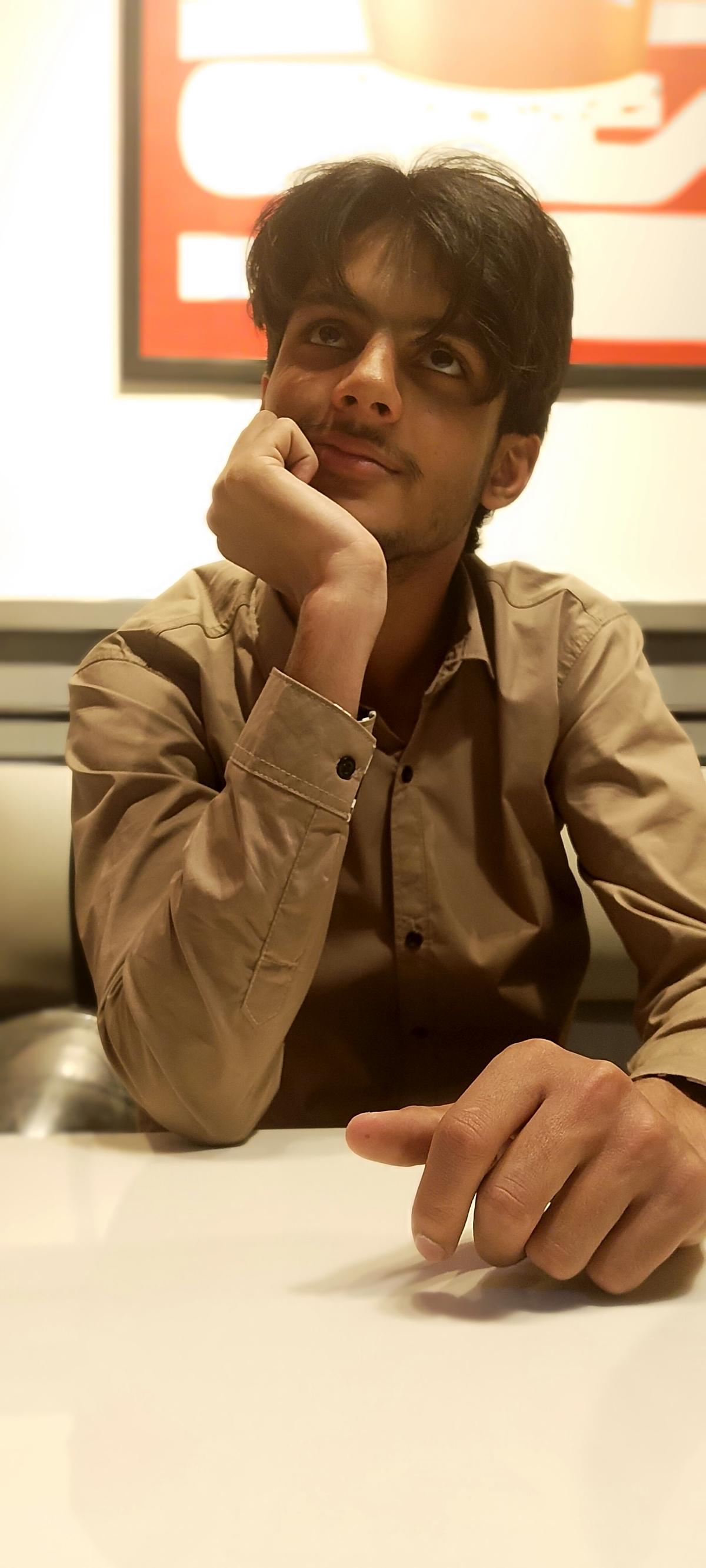 Deep Focus — At the desk, lost in product imagination by Muhammad Umer Aziz